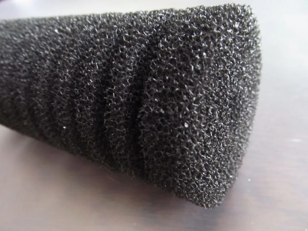 Small air-driven aquarium sponge filter with fine foam and no exposed intake slots